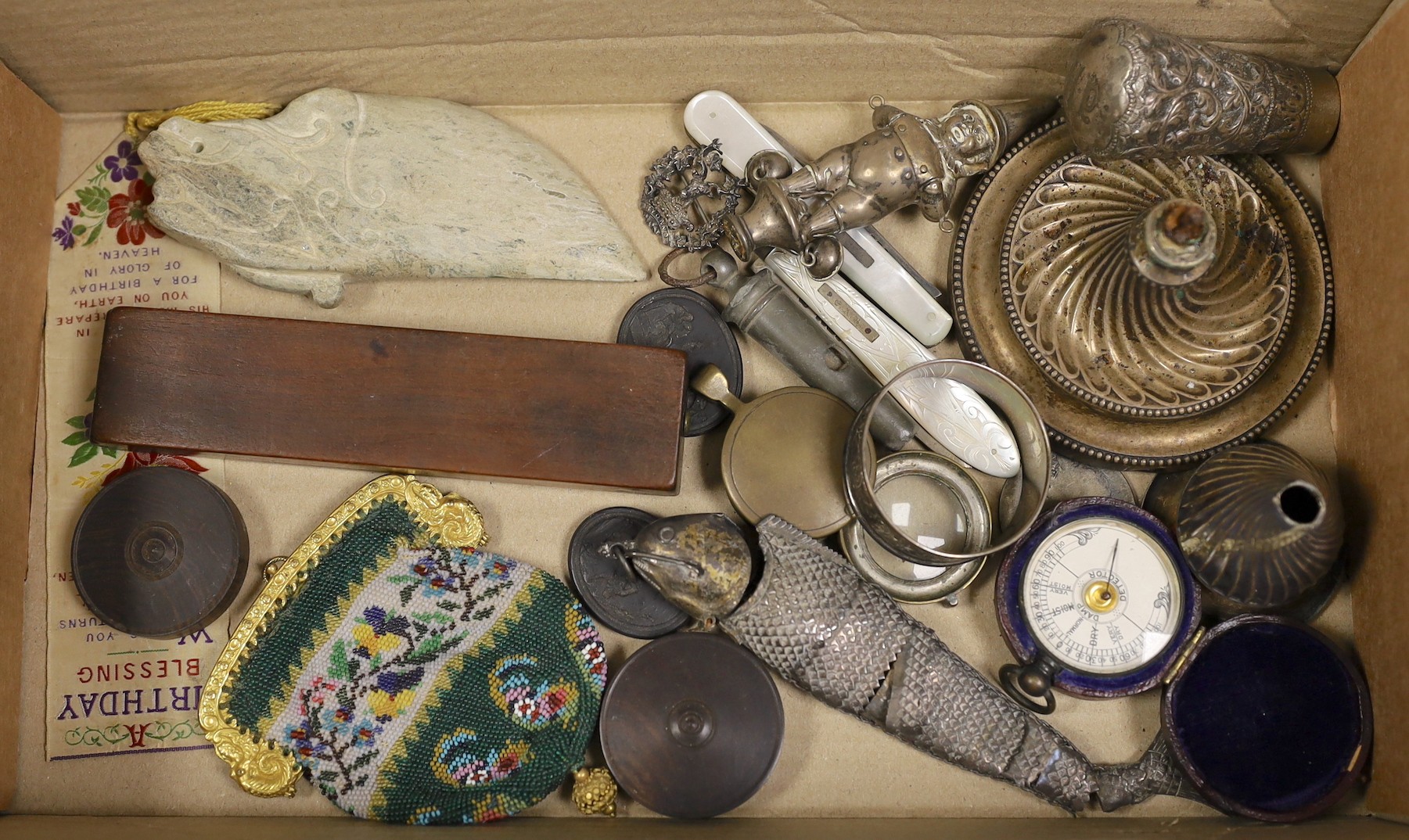 A small collection of curios including Wedgwood black basalt plaques, beadwork purse, cased barometer, silver bladed fruit knives, hardstone tool? etc.